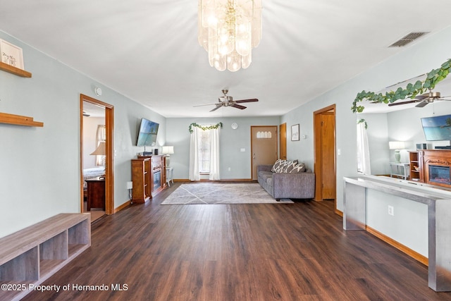 entryway featuring dark hardwood / wood-style floors and ceiling fan with notable chandelier