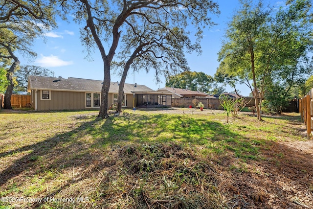 view of yard featuring a sunroom