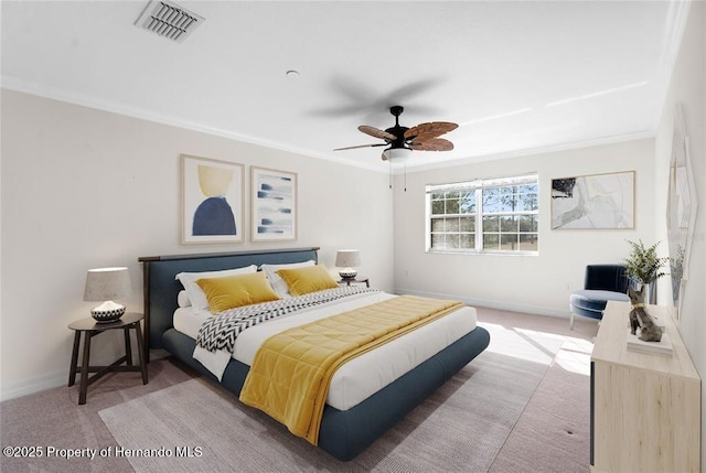 bedroom featuring ornamental molding, carpet floors, and ceiling fan