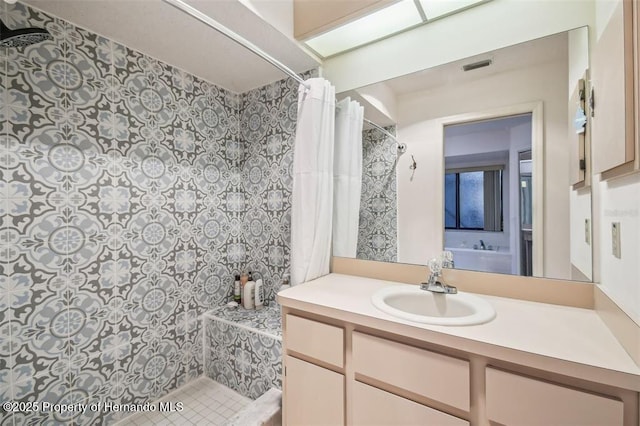 bathroom with vanity and walk in shower