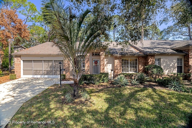 ranch-style house with a garage and a front yard