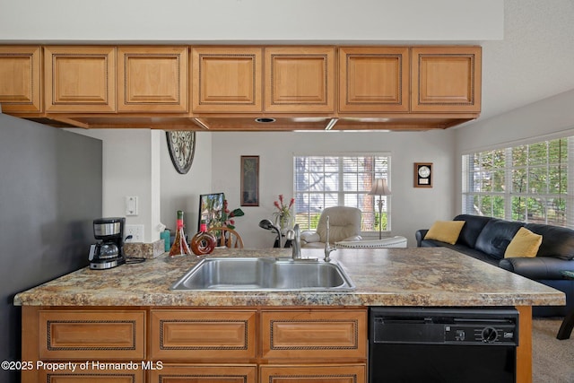 kitchen featuring dishwasher, sink, stainless steel fridge, and kitchen peninsula