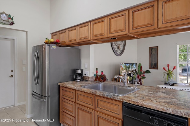 kitchen featuring stainless steel refrigerator, light tile patterned flooring, black dishwasher, and sink