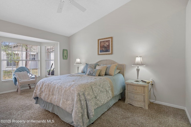 bedroom with vaulted ceiling, carpet floors, ceiling fan, and a textured ceiling