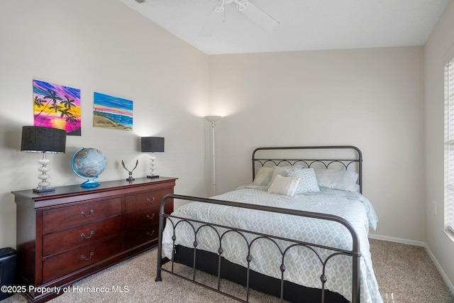 bedroom featuring ceiling fan and light carpet