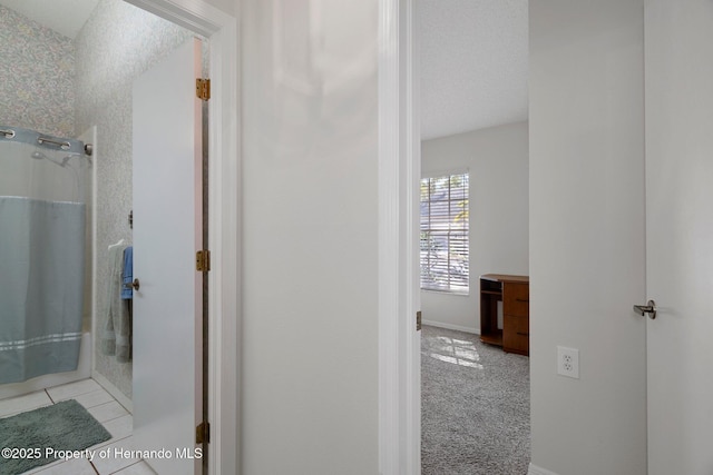 bathroom featuring tile patterned floors, a textured ceiling, and a shower with shower curtain