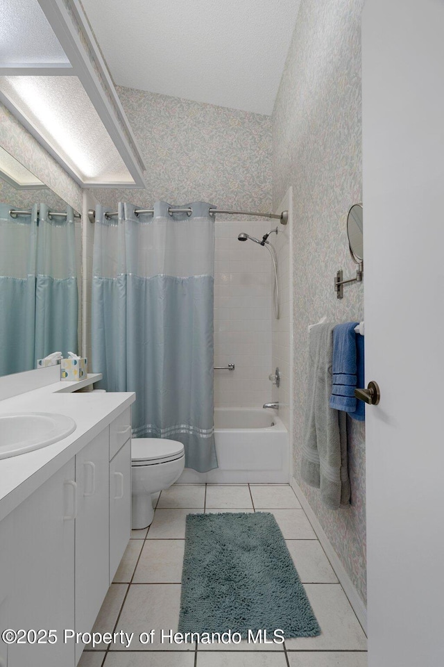 full bathroom with tile patterned flooring, vanity, shower / tub combo, and toilet