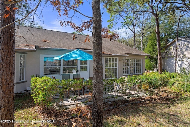 rear view of house featuring a patio