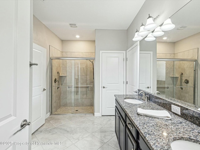 bathroom featuring vanity and walk in shower