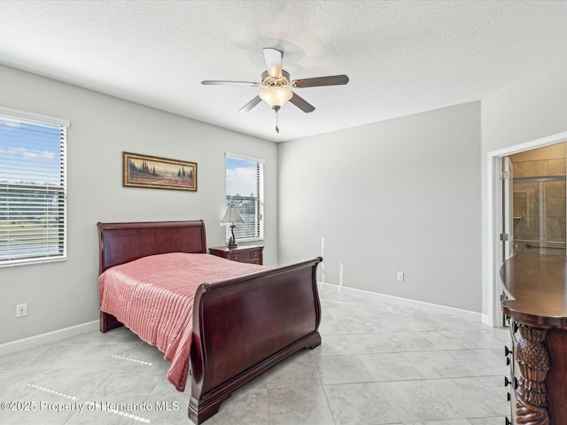 bedroom featuring light tile patterned flooring, ceiling fan, and a textured ceiling