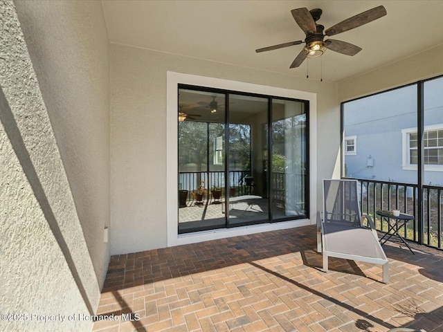 view of patio featuring ceiling fan