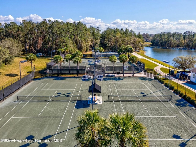 view of sport court with a water view