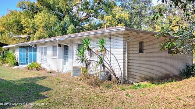 view of home's exterior featuring a yard