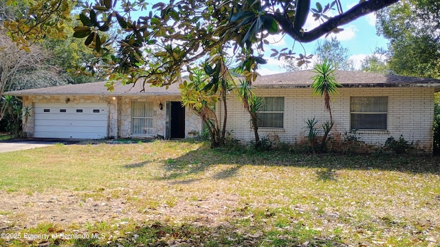 single story home featuring a garage and a front lawn