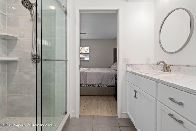 bathroom featuring vanity and a shower with shower door