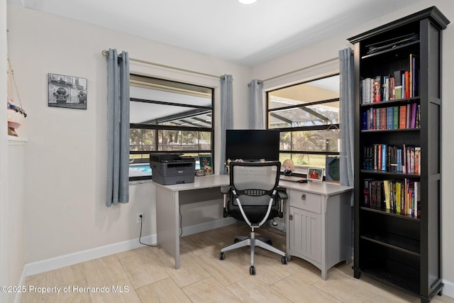 home office featuring a healthy amount of sunlight