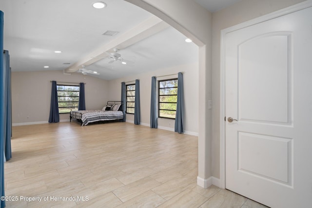 bedroom featuring lofted ceiling with beams and light hardwood / wood-style floors