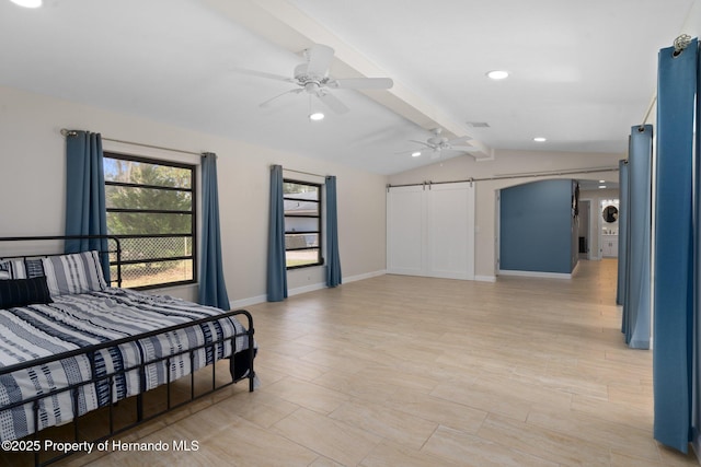 bedroom featuring ceiling fan, a barn door, and vaulted ceiling with beams