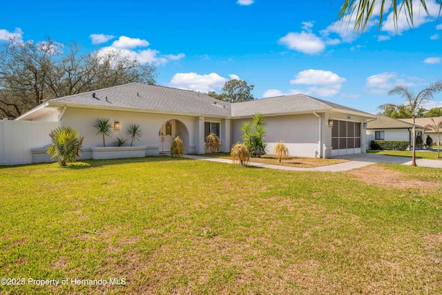ranch-style home with a front lawn