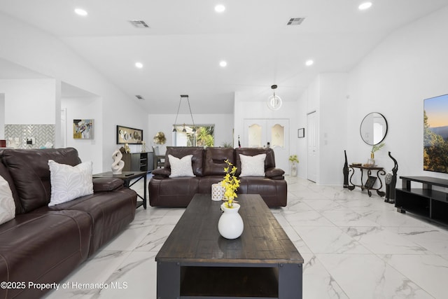 living room featuring high vaulted ceiling