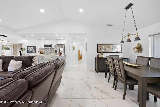 living room featuring vaulted ceiling