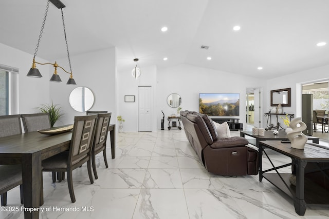 dining room with lofted ceiling