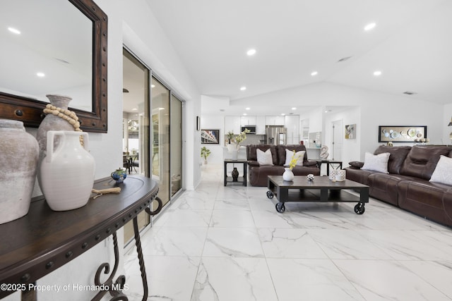 living room featuring vaulted ceiling