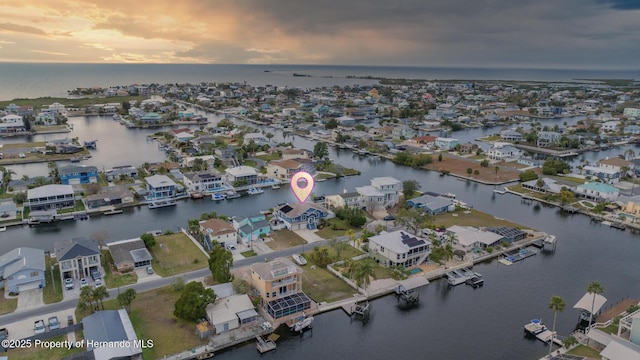 aerial view at dusk with a water view