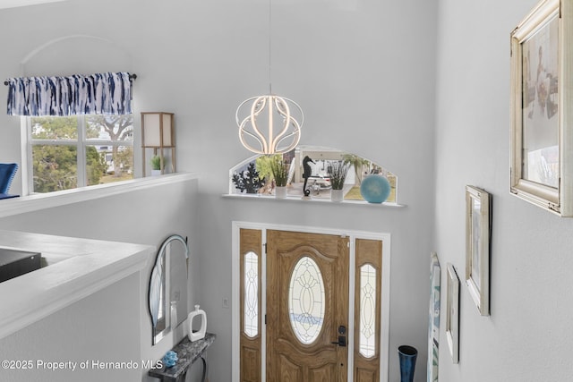 entryway featuring an inviting chandelier