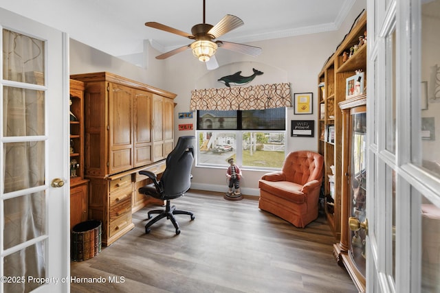 office area featuring hardwood / wood-style flooring, ornamental molding, and ceiling fan