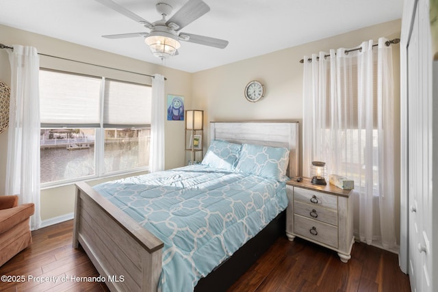 bedroom featuring dark hardwood / wood-style floors and ceiling fan