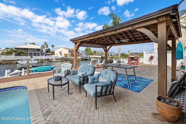 view of patio featuring a water view and a gazebo