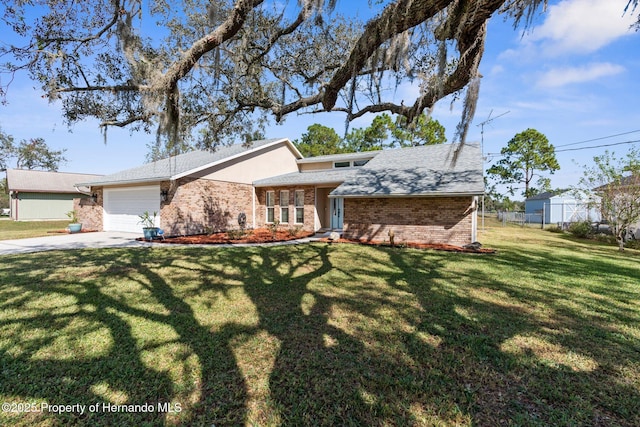 view of front facade featuring a garage and a front lawn