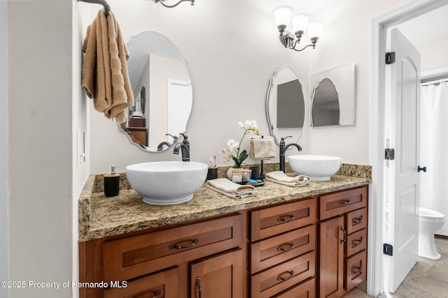 bathroom with vanity and toilet