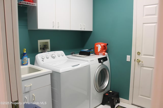 15033 Middle Fairway Dr, Spring Hill, FL 34609 - laundry room with separate washer and dryer and cabinets