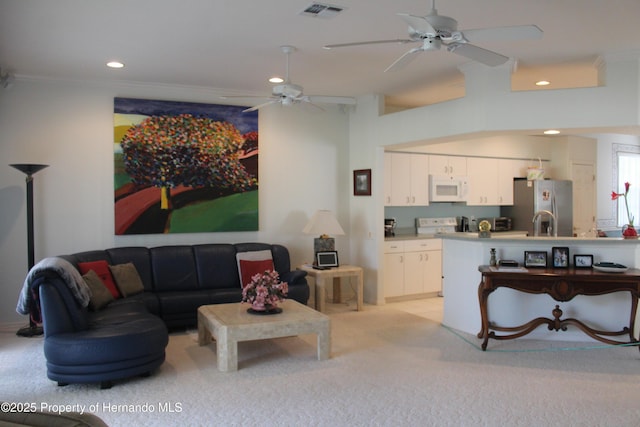 15033 Middle Fairway Dr, Spring Hill, FL 34609 - carpeted living room featuring ceiling fan