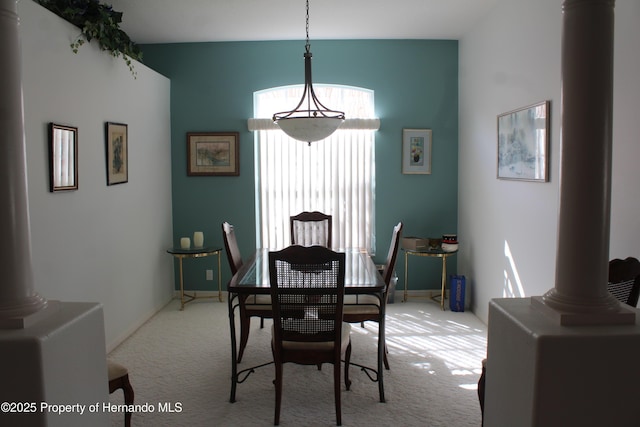 15033 Middle Fairway Dr, Spring Hill, FL 34609 - dining area with light colored carpet and decorative columns