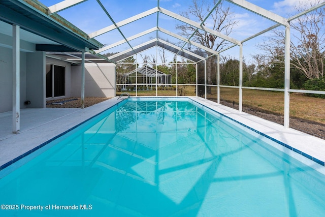 view of pool featuring a lanai and a patio area