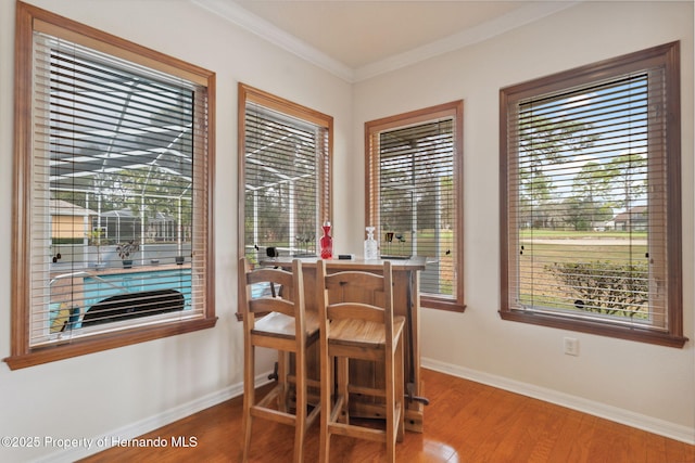 5351 Championship Cup Ln, Spring Hill, FL 34609 - dining area with hardwood / wood-style floors and ornamental molding