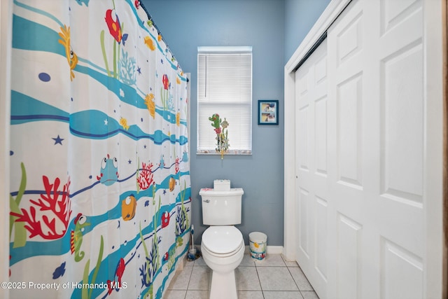 5351 Championship Cup Ln, Spring Hill, FL 34609 - bathroom featuring curtained shower, tile patterned floors, and toilet