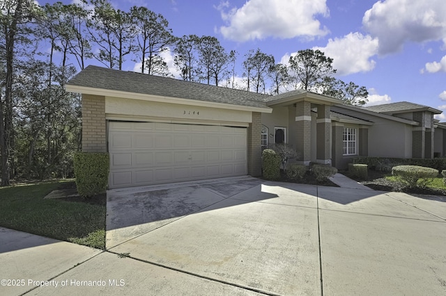 ranch-style house featuring a garage