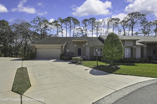 view of front facade featuring a garage and a front lawn