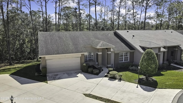 ranch-style house featuring a garage and a front yard