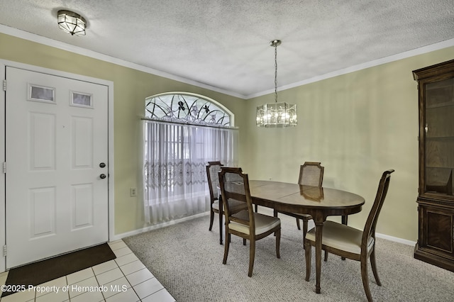 tiled dining room with ornamental molding, a notable chandelier, and a textured ceiling