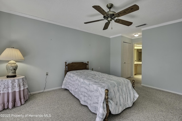 bedroom with crown molding, ensuite bath, a textured ceiling, carpet floors, and ceiling fan