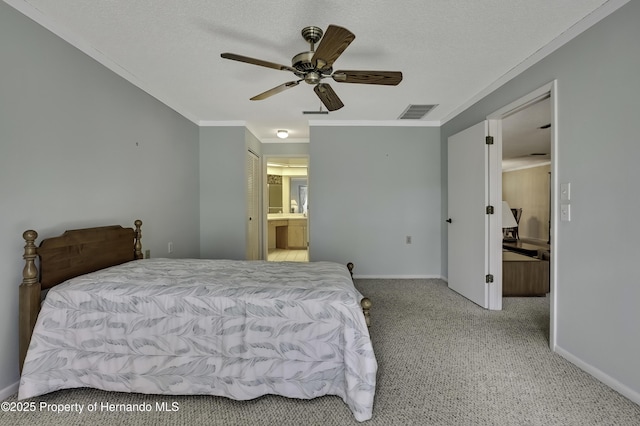 carpeted bedroom with ceiling fan, ornamental molding, ensuite bathroom, and a textured ceiling