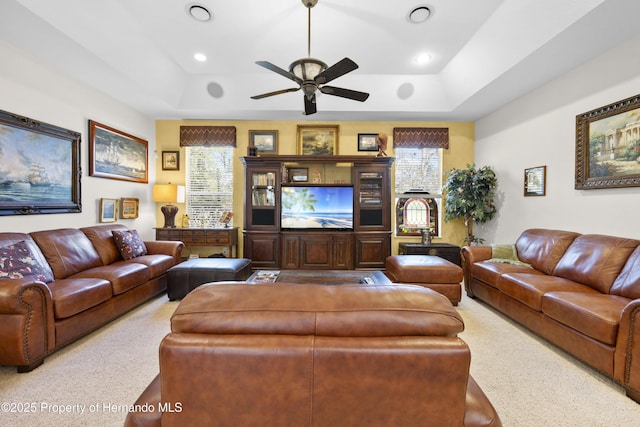 5685 W Pine Ridge Blvd, Beverly Hills, FL 34465 - carpeted living room with a raised ceiling and ceiling fan