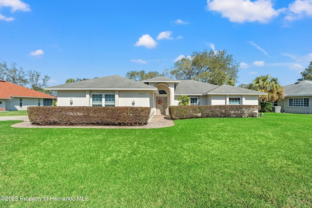 ranch-style house with a front yard