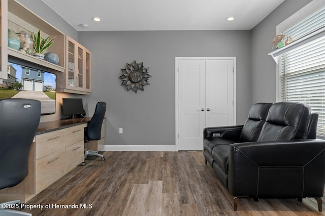 home office featuring baseboards, dark wood-type flooring, and recessed lighting