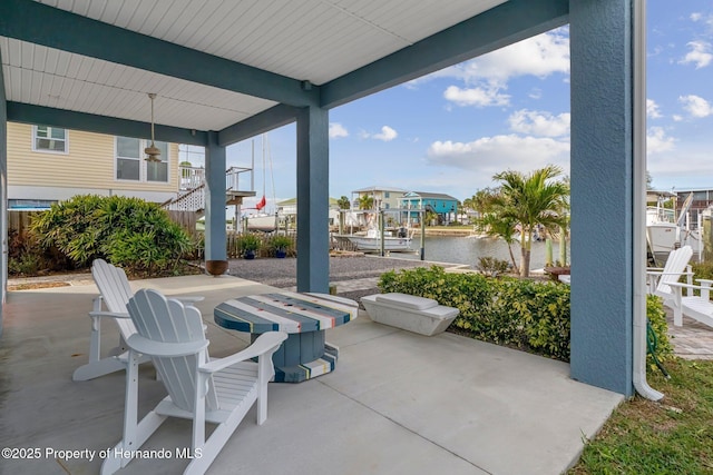 view of patio / terrace with a water view